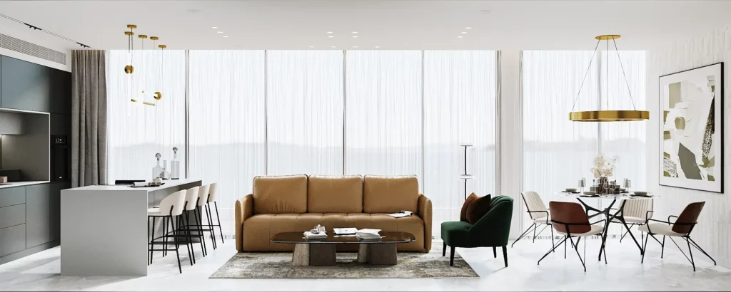 חלל פתוח ומואר עם מטבח אפור, ספה חומה, שולחן אוכל עגול וחלונות גדולים עם וילונות לבנים.